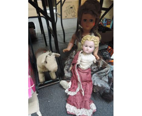 A vintage plush push along dog and A celluliod Athena doll and similar doll
