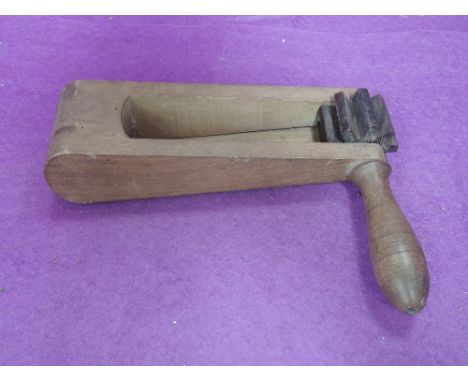 A vintage treen football rattle
