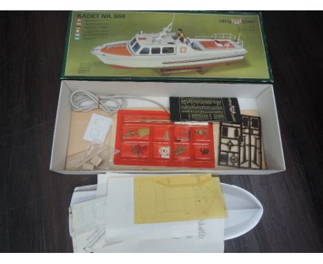 A Billing Boats model kit, Kadet NR566, part built along with two Dragon 1:700 scale plastic kits, warships, unmade