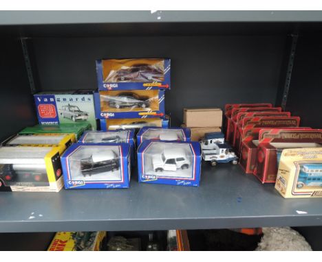 A shelf of mixed vintage diecasts including Corgi (swansea) BMW, Mercedes cars, Corgi (leicester) Mini's, Vanguards, Models o