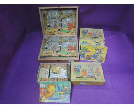 A vintage children's 20 piece wooden block puzzle set in box and two similar six block sets, both boxed