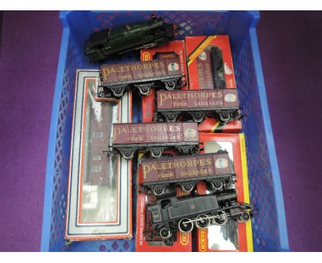 A Lima 00 gauge 2-6-2 tank engine and eight Hornby 00 gauge Palethorpes wagons etc