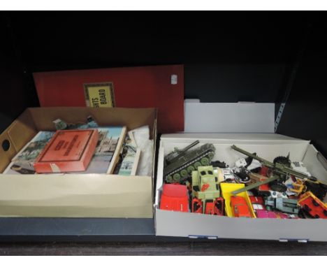 A shelf of mixed diecasts including Matchbox, Dinky etc, a selection of wooden jigsaws and a draughts set