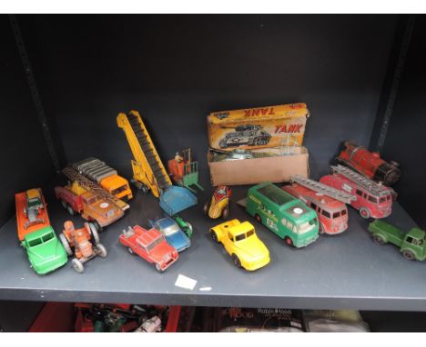 A shelf of mixed diecast and tin plate vehicles including Matchbox, Lone Star, Arnold etc and a Japanese remote controlled ta