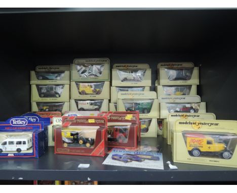 A shelf of Matchbox Models of Yesteryear and similar diecasts, all in window display boxes