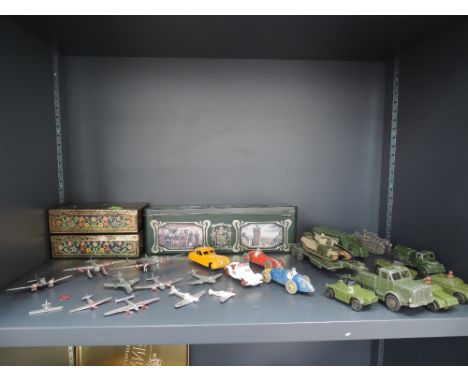 A shelf of Dinky diecasts including Jaguar 157, MG Midget 109, Ferrari 23H, Maserati 23N, military vehicles and areoplanes