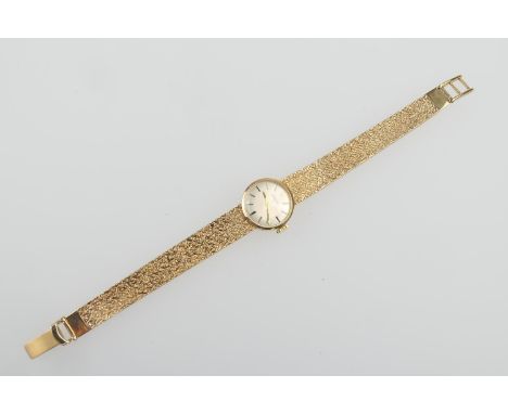 Garrard 9ct gold  lady's bracelet wristwatch, circa 1977, silvered 14mm dial with baton numerals, manual wind movement, the b