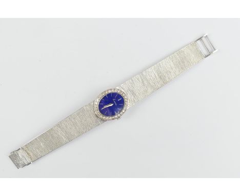 Kutchinsky 18ct white gold and diamond  lady's bracelet wristwatch, import marks for London 1968, blue oval dial with baton n