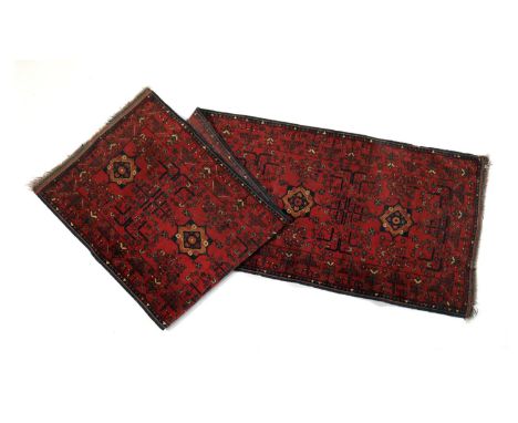 Hamadan red ground runner, centred with star shaped medallions in brown, terracotta and blue, the field dispersed with floral