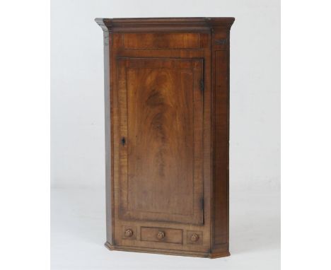 Mahogany and inlaid flat front hanging corner cupboard, early 19th Century, having a keyed inlaid frieze in boxwood and ebony