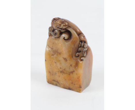 Chinese carved soapstone seal, surmounted with a dragon, nicely patinated, 6cm (NB: Condition is NOT noted in catalogue descr