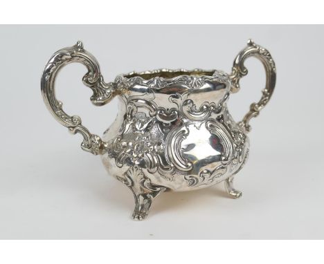 Victorian silver sucrier, maker WH, London 1853, repousse baluster form with flowers and C-scrolls, crested cartouche, height