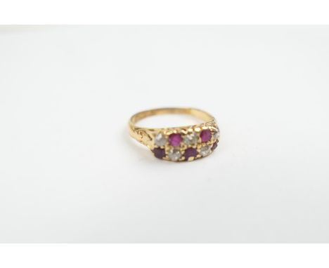 Diamond and ruby cluster ring in 18ct yellow gold, having two rows of alternating rubies and old round cut diamonds comprisin