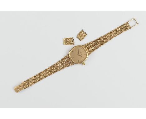 Omega 9ct gold lady's bracelet wristwatch, the gold coloured cushion form 19mm dial, signed and with baton numerals, cabochon