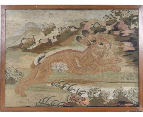 Woolwork tapestry panel featuring a running hare, 19th Century, later framed and glazed, 40cm x 55cm (NB: Condition is NOT no