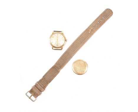 A hallmarked 9ct yellow gold Longines Baume wristwatch. The watch having a champagne coloured dial, alternating Arabic numera