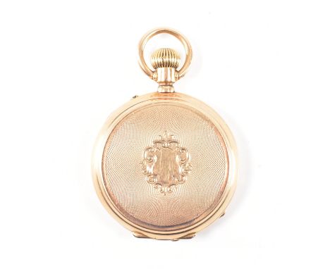 An early 20th Century French 9ct gold full hunter pocket fob watch. The watch having an engine turned case with unmarked armo