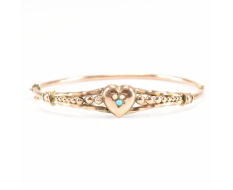 A 19th Century Victorian 9ct gold turquoise bangle bracelet. The bracelet having a heart to the with pierced balled detailing