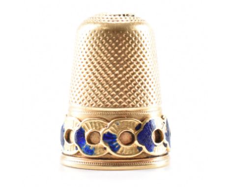 A late 19th Century antique gold and enamel thimble. The thimble having moulded detailing to rim with remnants of blue enamel