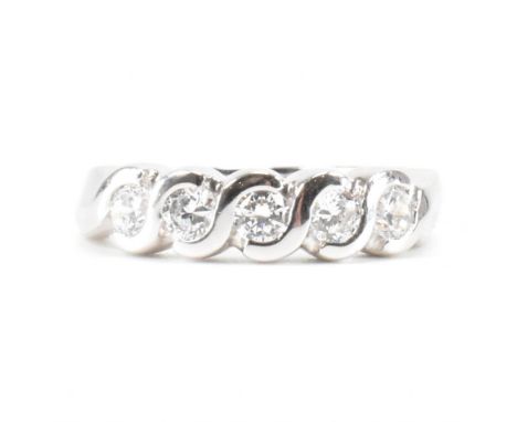 A hallmarked 9ct white gold five stone half eternity ring. The ring set with five round brilliant cut cubic zirconia CZ to pl