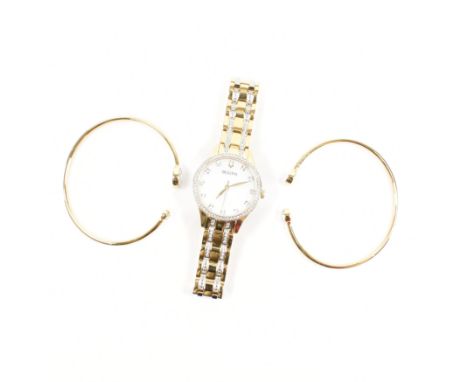 A Bulova wristwatch &amp; bangle bracelet demi parure. The watch having a mother of pearl dial with illusion set white stone 