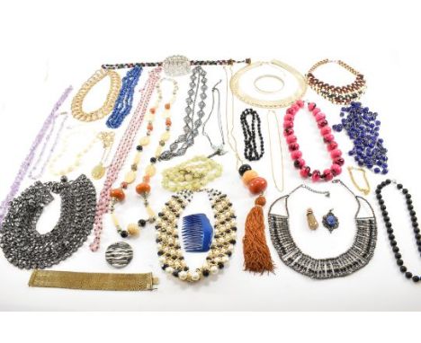 A collection of vintage costume jewellery to include collar necklaces, beaded necklaces, a lapis lazuli necklace, an amethyst