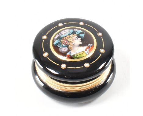 A French 18ct gold pearl enamel pill box. The box having an applied enamel image of a maiden framed by half pearls set within