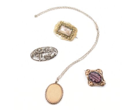 A gold plated 19th century Victorian hair locket brooch with central window and chased surround with pin verso. AF. Total wei