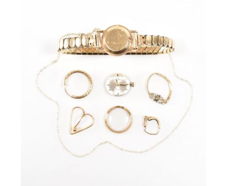 A hallmarked 9ct yellow gold rotary wrist watch together with gold jewellery fragments. The Rotary watch having a circular si