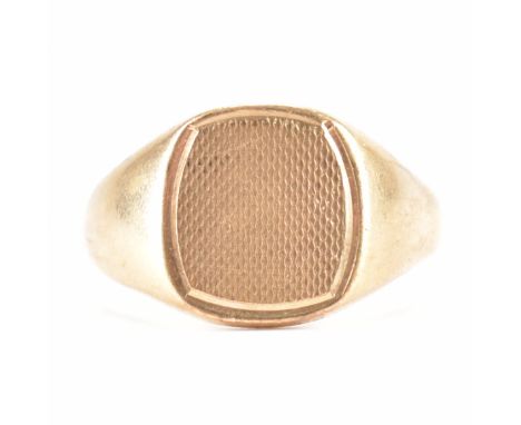 A hallmarked 9ct gold signet ring. The ring having a square head with engine turned head. Hallmarked Birmingham 1942. Weight 