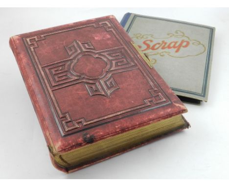 A red leather bound Victorian photograph album containing various portrait photographs, together with one other photograph al