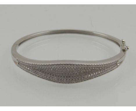 A silver and cubic zirconia set bangle. 