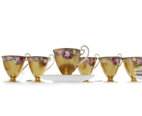 SET OF SIX EARLY 20TH CENTURY ROYAL WORCESTER COFFEE CUPS AND SAUCERScirca 1915, the border hand painted with flowers by W. H