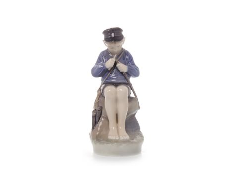 ROYAL COPENHAGEN FIGURE OF A BOY model 905, modelled as sat, whittling, on a rock, printed and painted marks to base, 19cm hi