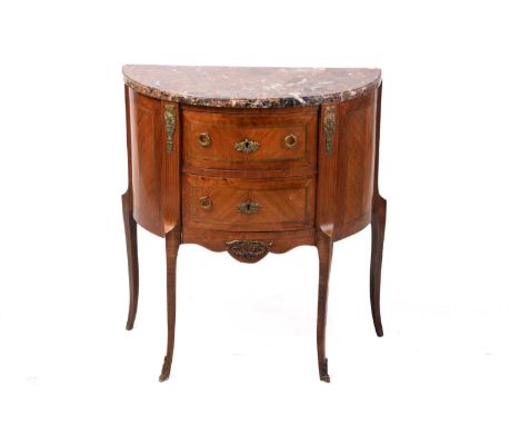 A Louis XV-style marble-topped tulipwood and mahogany demi lune petit commode, early 20th century, with gilt metal mounts and