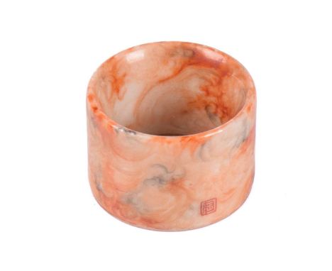 A Chinese porcelain Archers ring, painted throughout in marbled iron red and grisaille, with a gilt rim, red square Tao mark,