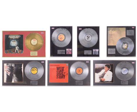 Seven framed presentation silver and gold discs, each marking sales performance for various albums: The Rolling Stones, 'Stic