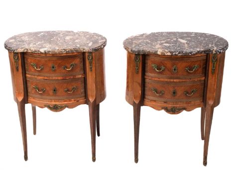 A pair of Louis XV style marble topped kidney-shaped petit commode chests, early 20th century, each with two shaped drawers s