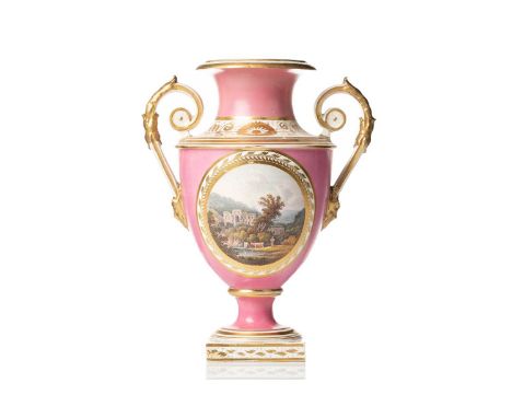 A 19th-century Derby porcelain twin-handled vase, with a hand-painted view of Rievaulx Abbey, Yorkshire, pink ground with gil