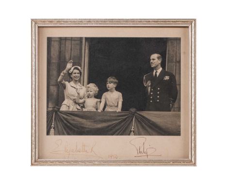 An original 1954 signed photograph of Queen Elizabeth II and Prince Philip, standing on the balcony at Buckingham Palace with