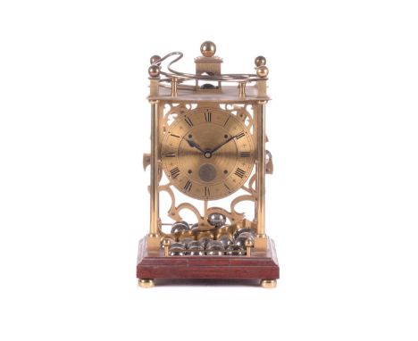 A modern lacquered brass spherical weight timepiece, by Harding &amp; Bazeley, Cheltenham, England, the brass Roman dial fitt