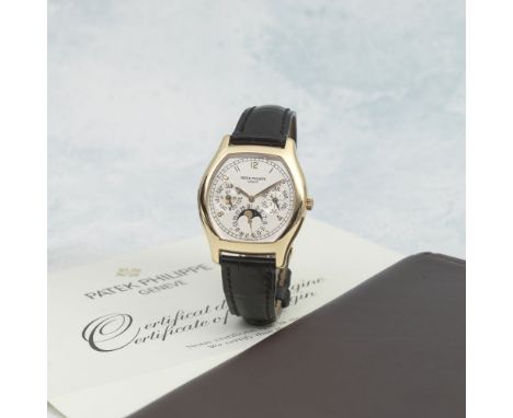 Patek Philippe. A fine and rare 18K rose gold automatic perpetual calendar wristwatch with moon phase and 24 hour indicationR