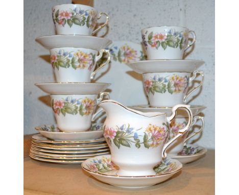 A Paragon Country Lane six setting tea service inc. cake plate, six trio's milk jug etc. 