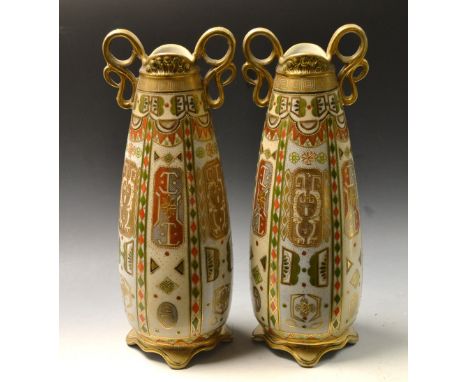 A pair of Noritake twin handled tapering cylinder vases, decorated with gilt, orange and green geometric panels, printed mark