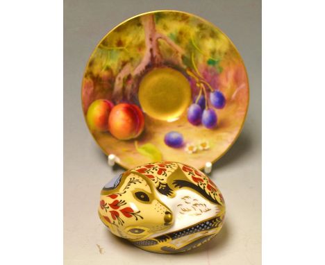 A Royal Worcester shaped circular saucer, signed, painted with peaches and berries on a mossy ground ; a royal crown paperwei