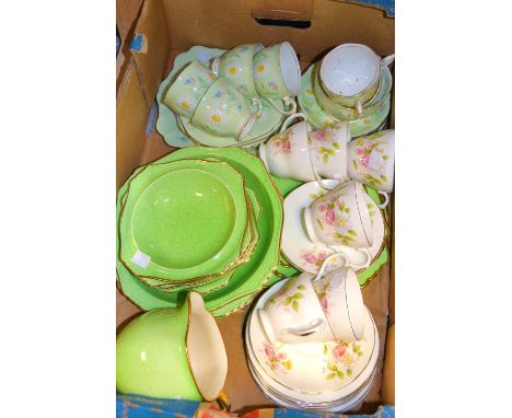 A Crown Ducal dessert set, with cream jug; a Staffordshire floral tea set for six; another; qty