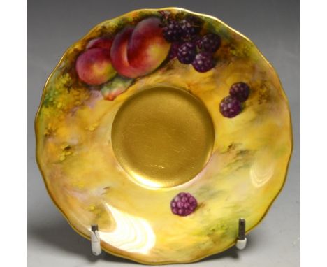 A Royal Worcester shaped circular saucer, signed, painted with peaches and blackberries on a mossy ground, printed crown and 