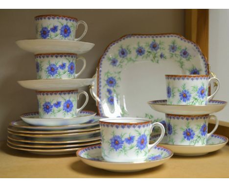 An Aynsley six setting tea service, decorated with cornflowers, comprising bread and butter plate, side plates, cups and sauc