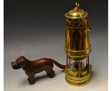 A Davis of Derby brass colliery lamp; a dog nutcracker (2)