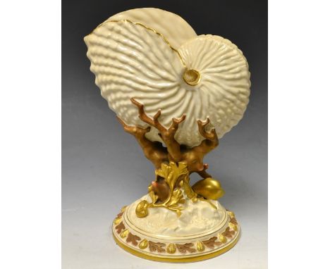 A Royal Worcester Nautilus shell vase, the base as coral and sea shells highlighted in gilt.